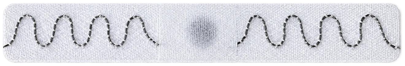 A Saphire One UHF RFID textile tag, with its stitched antenna and chip